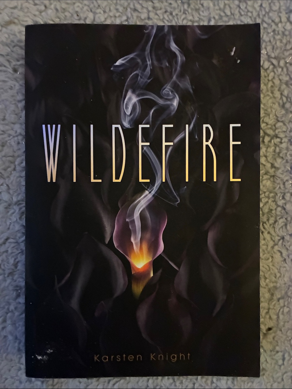 WILDEFIRE Book by Karsten Knight - Black Cover with Purple & Yellow Flame